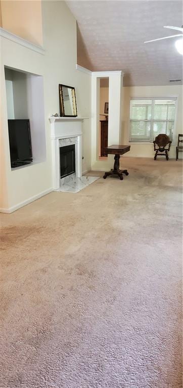 999 Simonton Glen Dr, Lawrenceville, GA 30045 - unfurnished living room featuring a high end fireplace, a ceiling fan, carpet, and vaulted ceiling