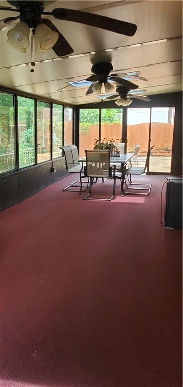 999 Simonton Glen Dr, Lawrenceville, GA 30045 - sunroom / solarium with ceiling fan, outdoor dining area, and carpet