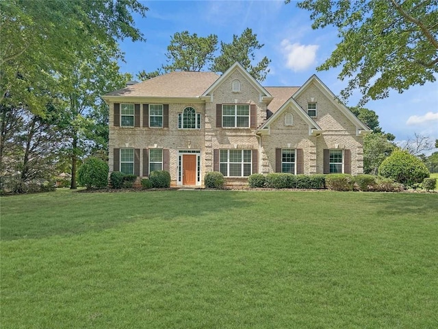 1525 Lake Dow Rd, Mcdonough, GA 30252 - view of front facade with a front yard and brick siding