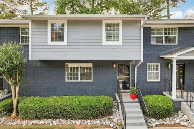 view of front of home with brick siding