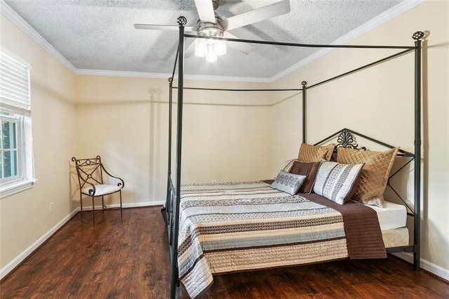 bedroom featuring a textured ceiling, wood finished floors, ornamental molding, baseboards, and ceiling fan