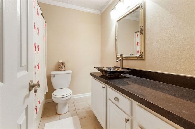bathroom with crown molding, toilet, vanity, and tile patterned floors