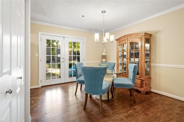 dining room with french doors, a chandelier, crown molding, a textured ceiling, and wood finished floors