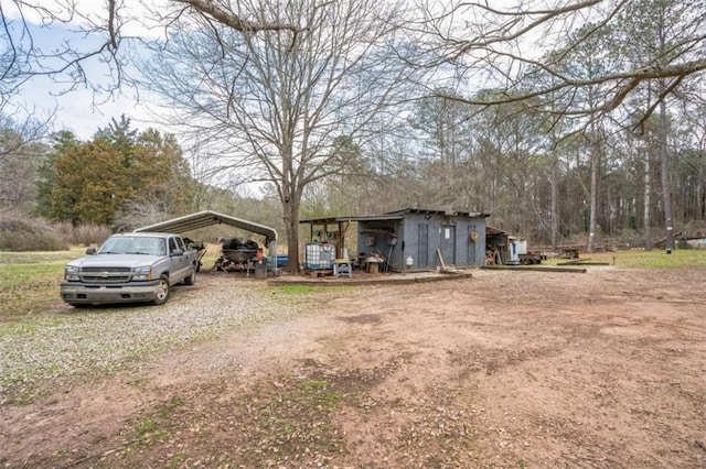 exterior space with a carport