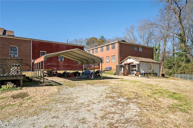 back of property featuring a carport