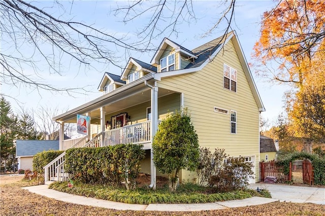 view of side of home featuring a porch