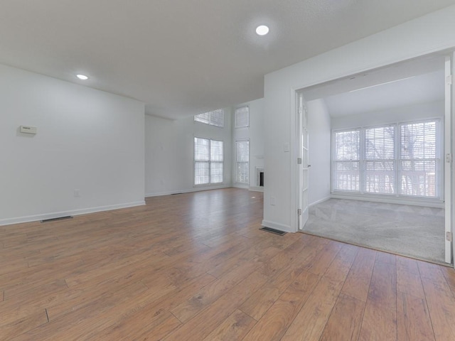 unfurnished room with light hardwood / wood-style floors