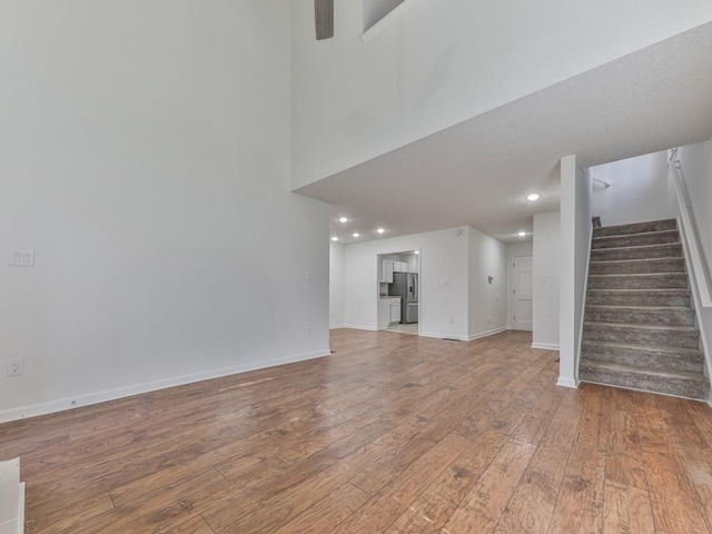 unfurnished living room featuring hardwood / wood-style floors