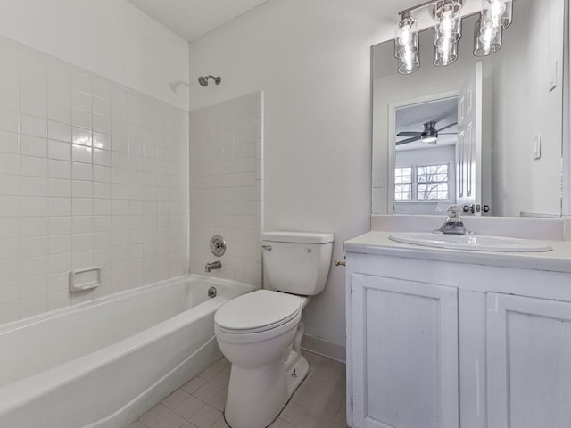 full bathroom featuring tiled shower / bath, tile patterned flooring, vanity, ceiling fan, and toilet