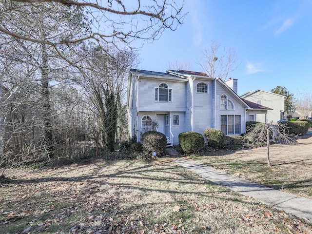 view of property with a front lawn