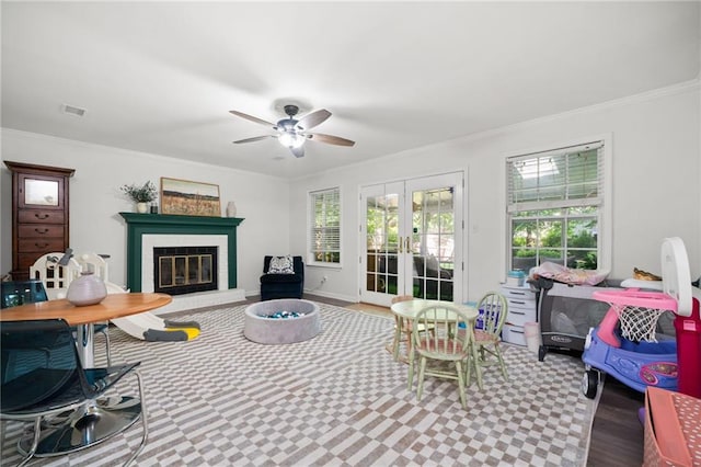 5552 Knox Pl, Peachtree Corners, GA 30092 - living area with french doors, a ceiling fan, a fireplace, and ornamental molding