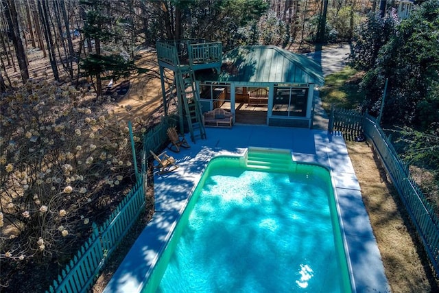 view of pool featuring a patio area, a fenced backyard, and a fenced in pool