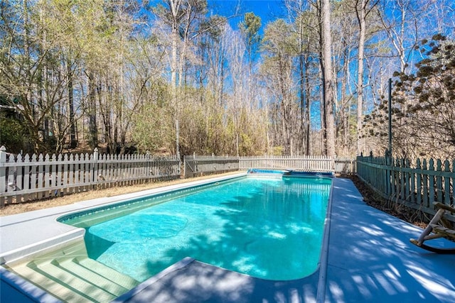 view of swimming pool with a fenced in pool and a fenced backyard