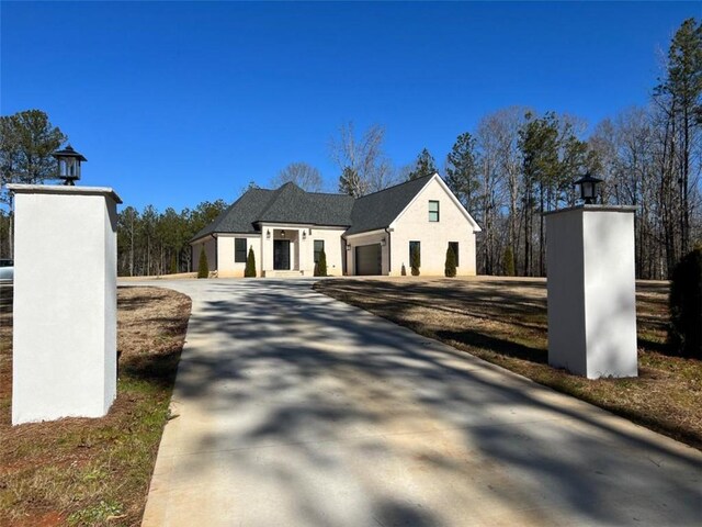 view of front of home with an attached garage and concrete driveway