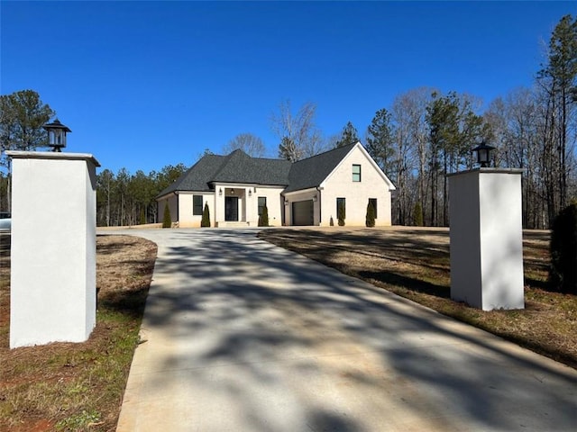 613 Bill Rutledge Rd, Winder, GA 30680 - view of property exterior with a garage, concrete driveway, and stucco siding