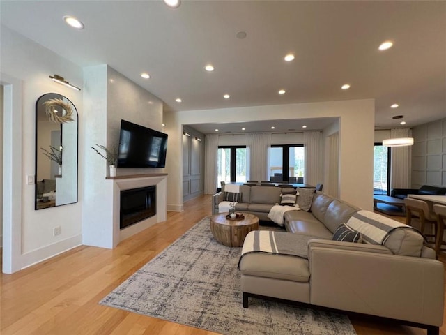 613 Bill Rutledge Rd, Winder, GA 30680 - living room featuring light wood finished floors, a fireplace, and recessed lighting