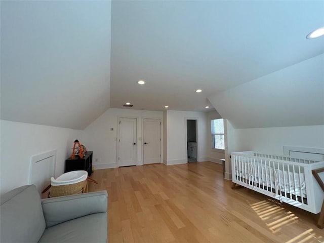 bedroom with lofted ceiling, light wood-style flooring, baseboards, and recessed lighting