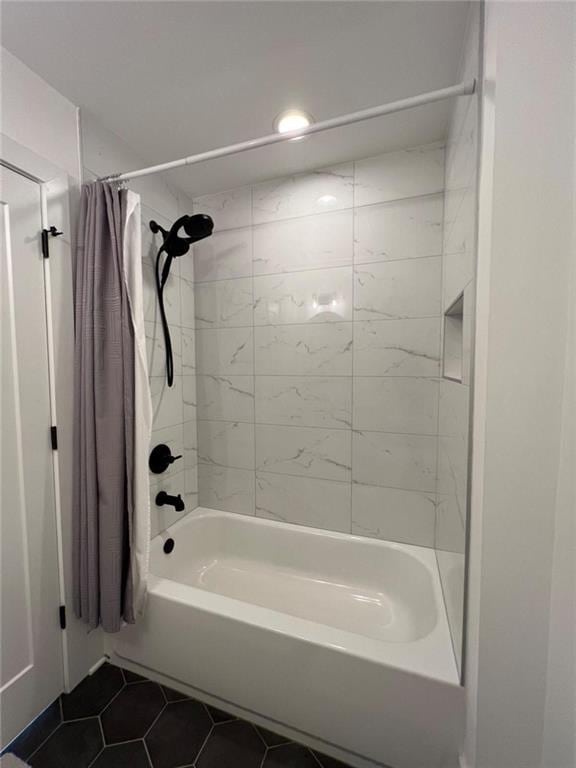 bathroom with shower / tub combo and tile patterned flooring