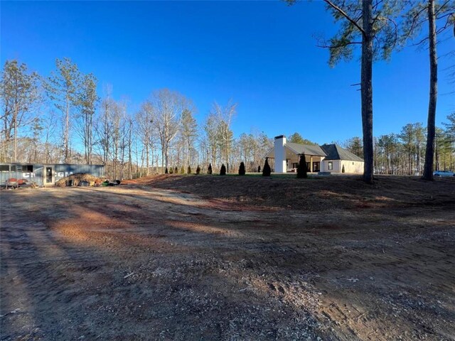 exterior space with dirt driveway