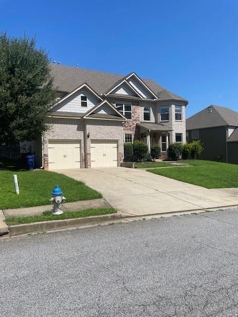 view of front of home featuring a garage and a front lawn