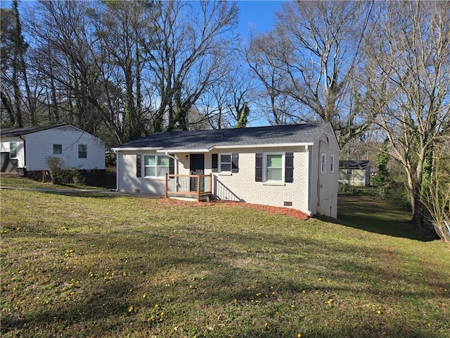 single story home with crawl space, a front yard, and brick siding