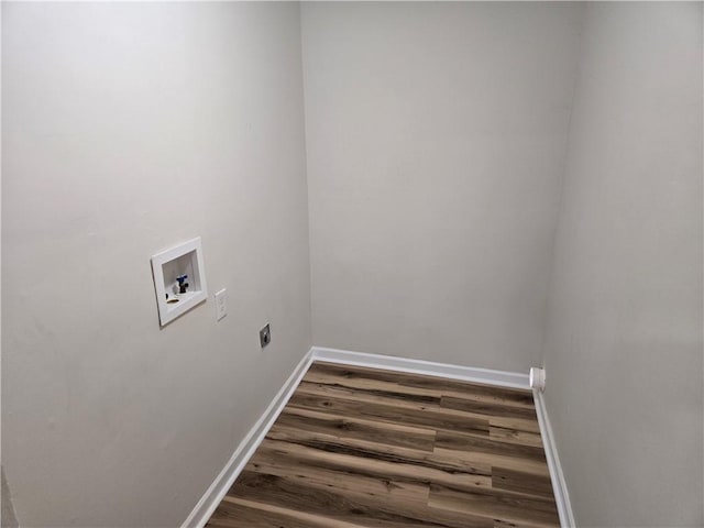 laundry room featuring washer hookup, electric dryer hookup, wood finished floors, laundry area, and baseboards