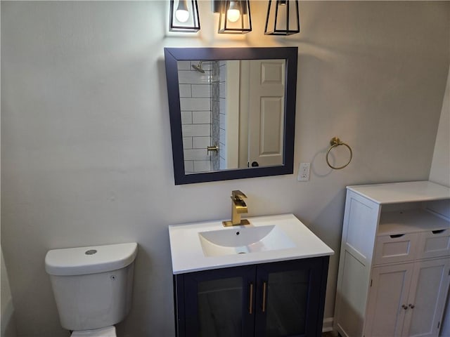 bathroom featuring toilet and vanity