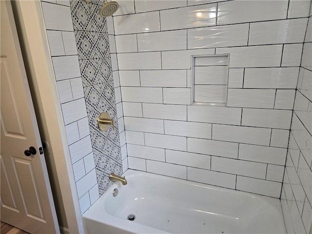 bathroom with washtub / shower combination