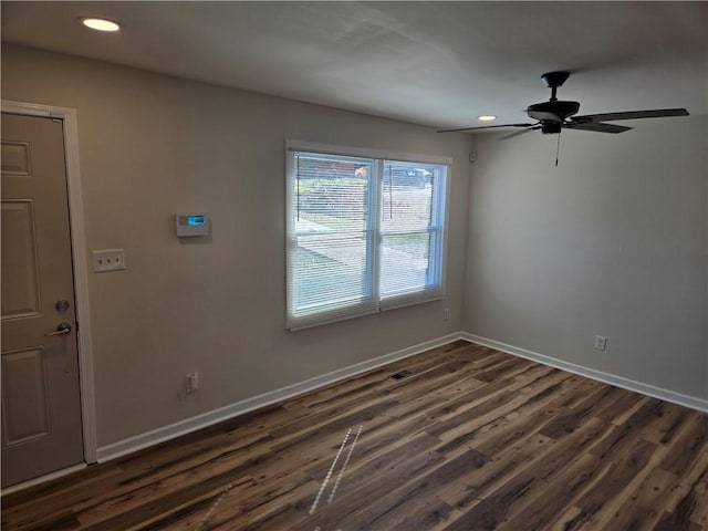 empty room featuring visible vents, baseboards, ceiling fan, dark wood-type flooring, and recessed lighting