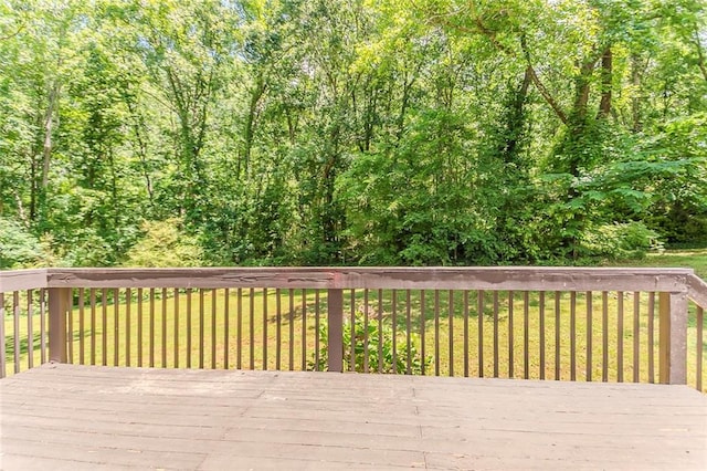wooden terrace with a yard