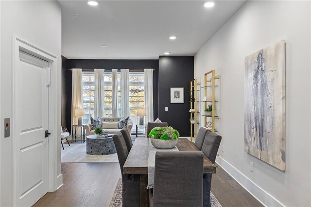 dining area featuring dark hardwood / wood-style floors