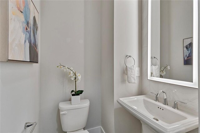 bathroom with sink and toilet