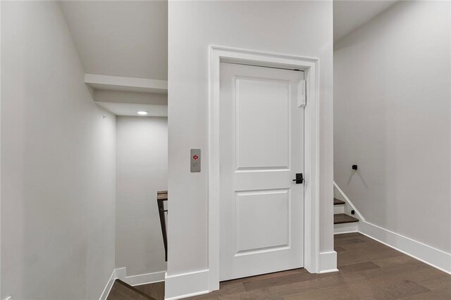 hall with dark hardwood / wood-style floors