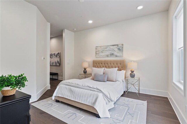 bedroom with dark wood-type flooring