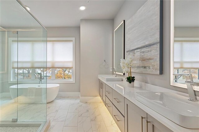 bathroom with vanity, separate shower and tub, and plenty of natural light