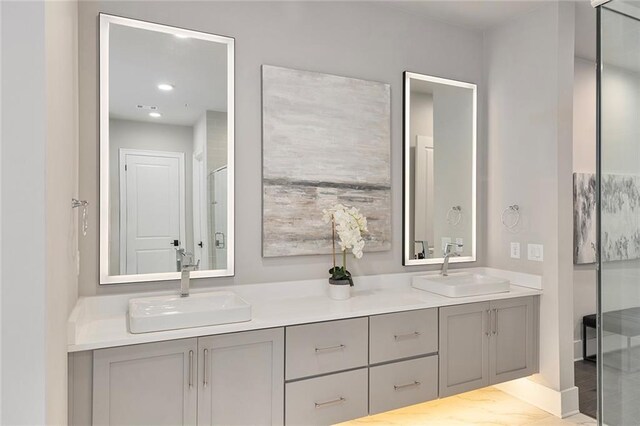 bathroom with vanity and walk in shower