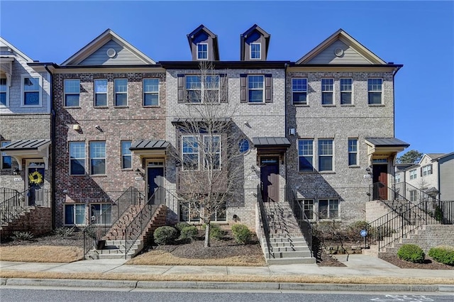 view of property featuring brick siding