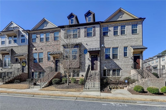 view of property with brick siding