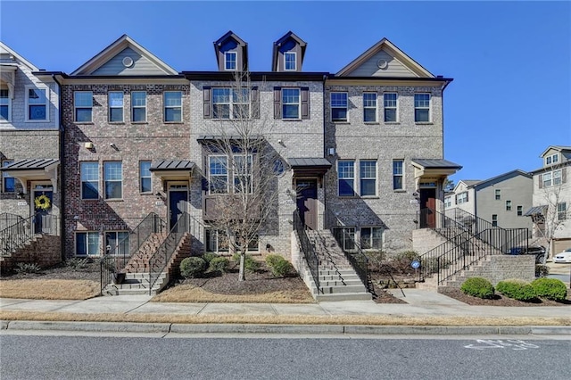 view of property with brick siding