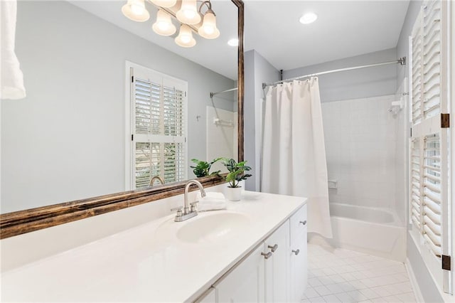 bathroom featuring shower / bath combination with curtain, tile patterned floors, and vanity