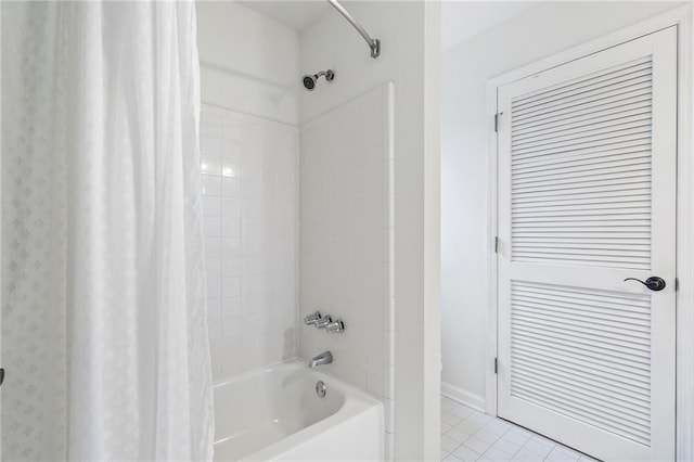 bathroom featuring tile patterned floors and shower / bath combo with shower curtain