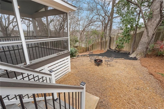 view of yard featuring an outdoor fire pit