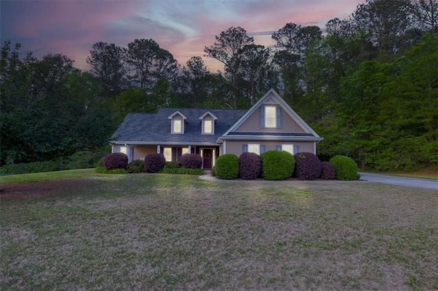 view of front of home with a lawn