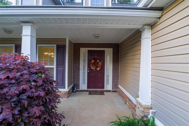 entrance to property featuring a porch