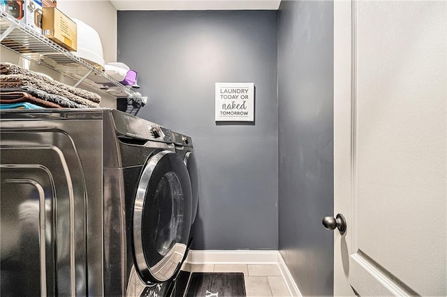 washroom with tile patterned floors and independent washer and dryer