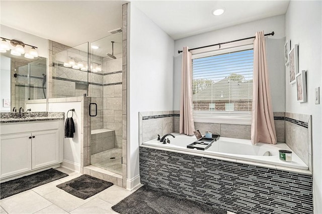 bathroom featuring vanity, separate shower and tub, and tile patterned floors