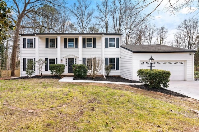 view of front of home with a garage and a front lawn