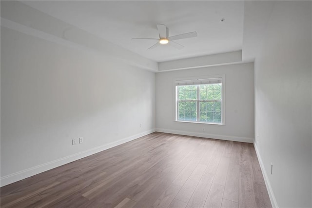 unfurnished room featuring ceiling fan and wood-type flooring