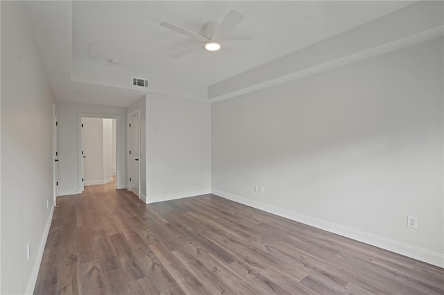 spare room featuring ceiling fan and light hardwood / wood-style flooring