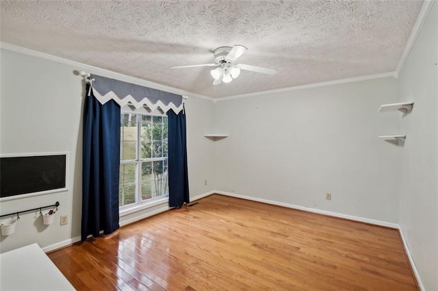 interior space with ceiling fan, a textured ceiling, crown molding, and hardwood / wood-style floors